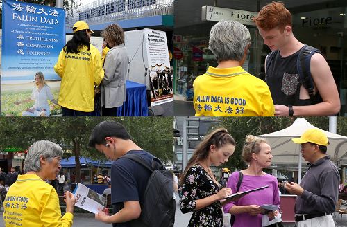 图1：法轮功学员在车士活市中心的维多利亚步行街上向民众讲真相